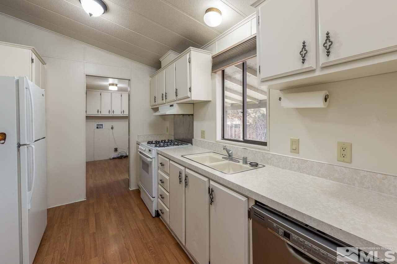 3945 Brant Street Reno, NV 89508 - Photo 10 of 19 a kitchen with a sink stove and cabinets