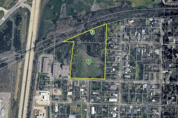 a view of houses with a street