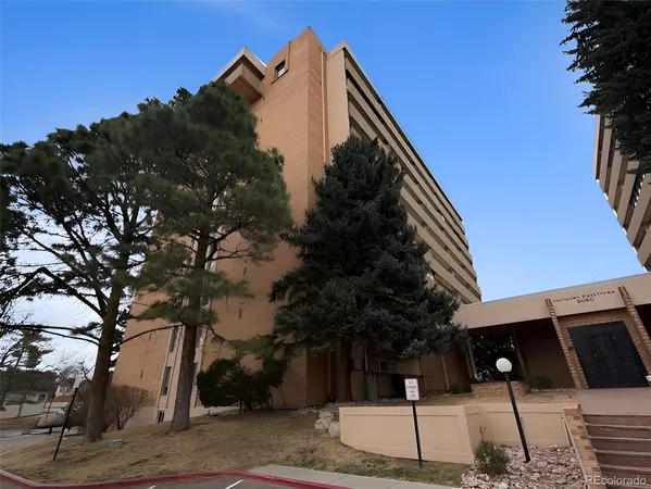 a view of a house with a tree