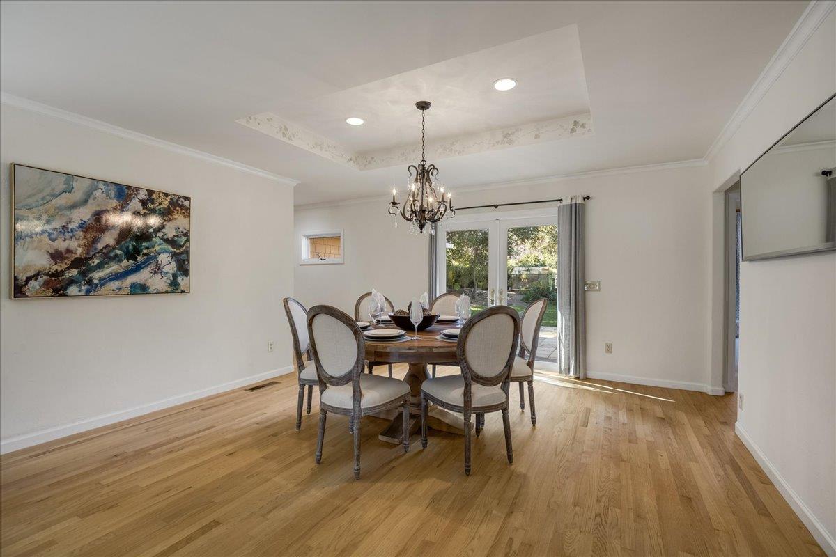 1034 Parma Way Los Altos, CA 94024 - Photo 11 of 49 a dining room with furniture a chandelier and wooden floor