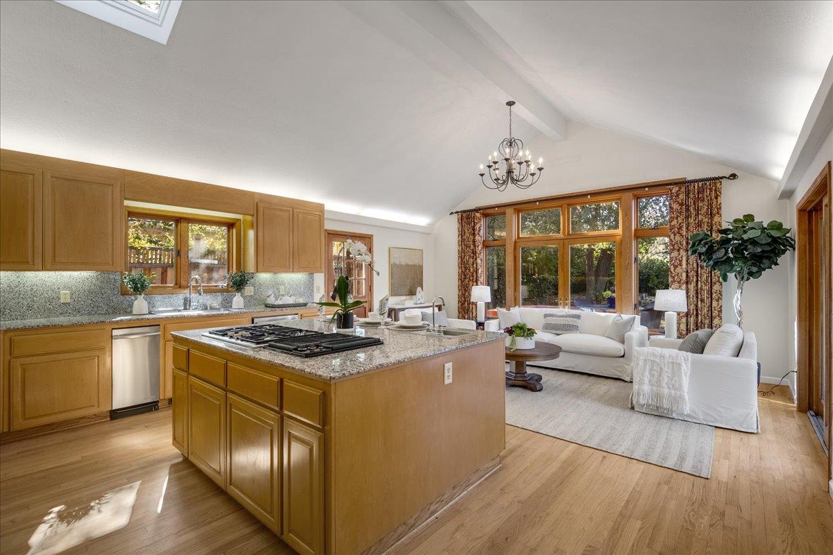 1034 Parma Way Los Altos, CA 94024 - Photo 14 of 49 a view of a kitchen counter top space with granite countertop wooden floor living room and windows