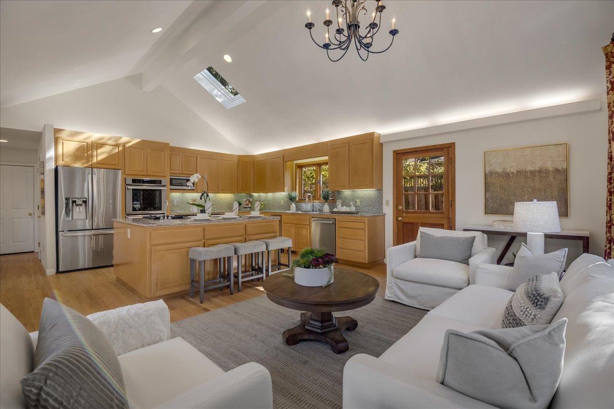 1034 Parma Way Los Altos, CA 94024 - Photo 18 of 49 a living room with furniture a chandelier a large window and kitchen view