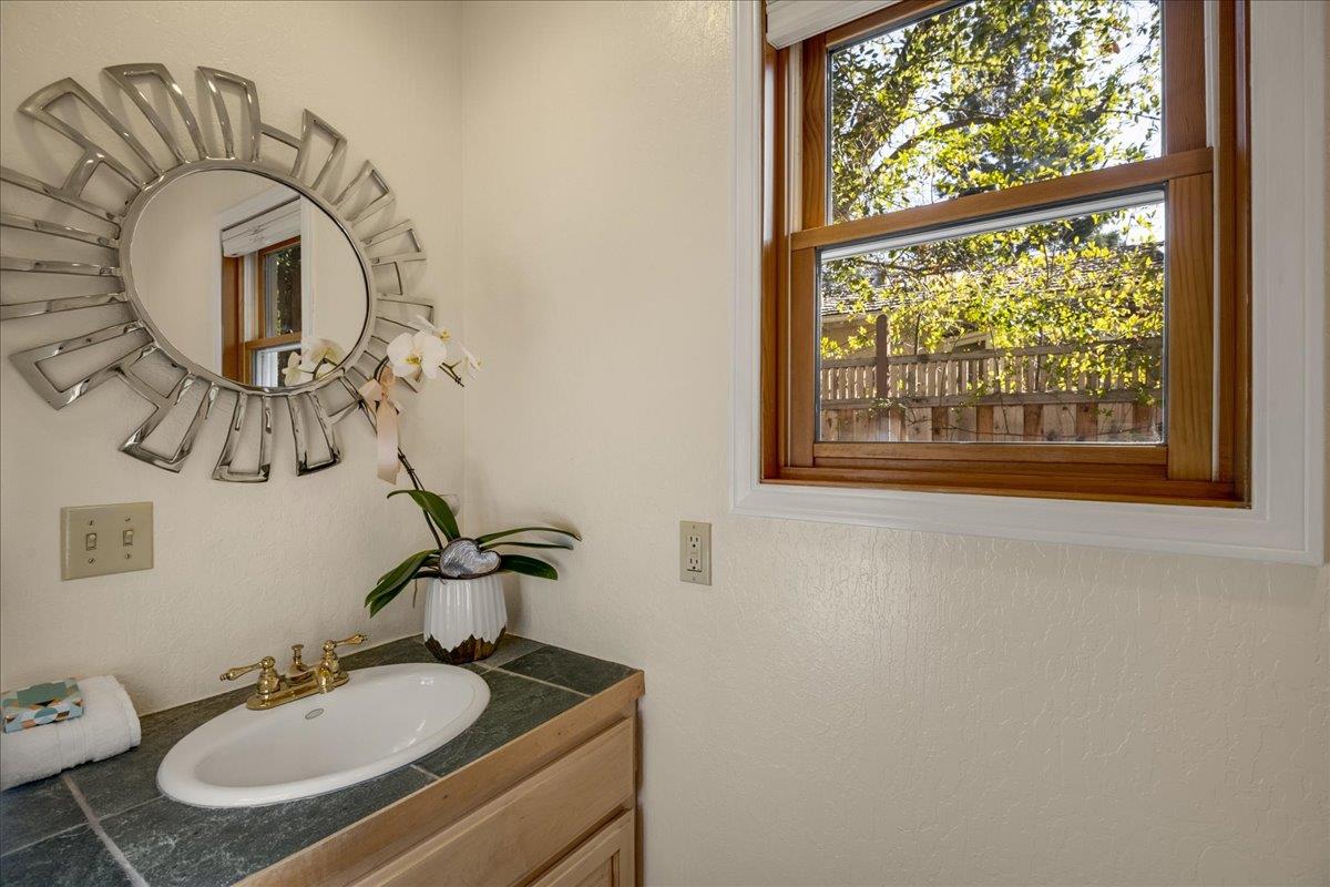 1034 Parma Way Los Altos, CA 94024 - Photo 24 of 49 a bathroom with a sink and a mirror