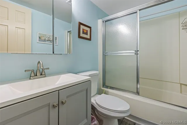 a bathroom with a sink toilet and vanity