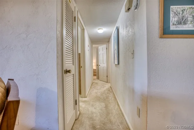 a view of hallway with livingroom