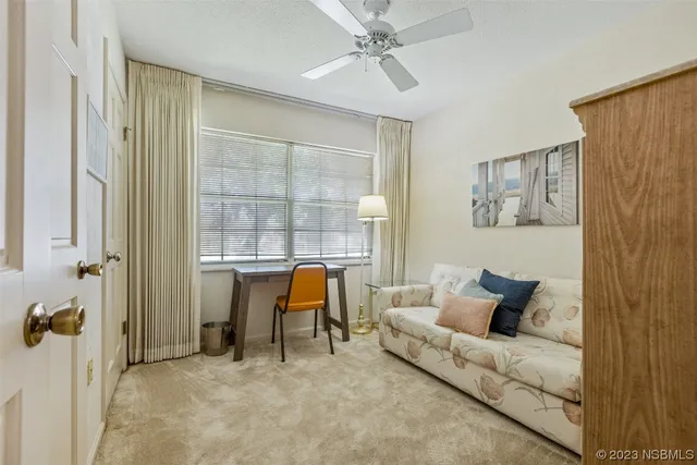 a living room with furniture and a window