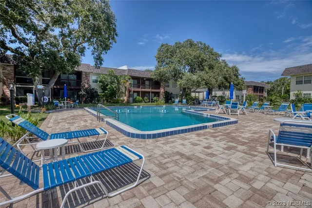 a view of a swimming pool with a patio