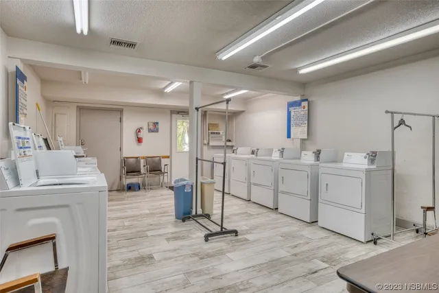 a kitchen with sink cabinets and appliances