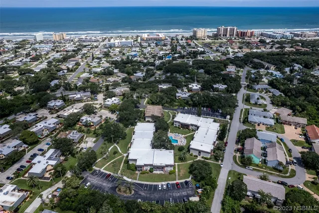 an aerial view of a house with a garden