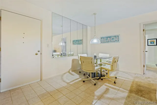 a work room with table and chairs