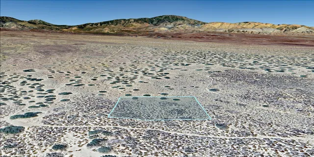 a view of an ocean beach and mountain