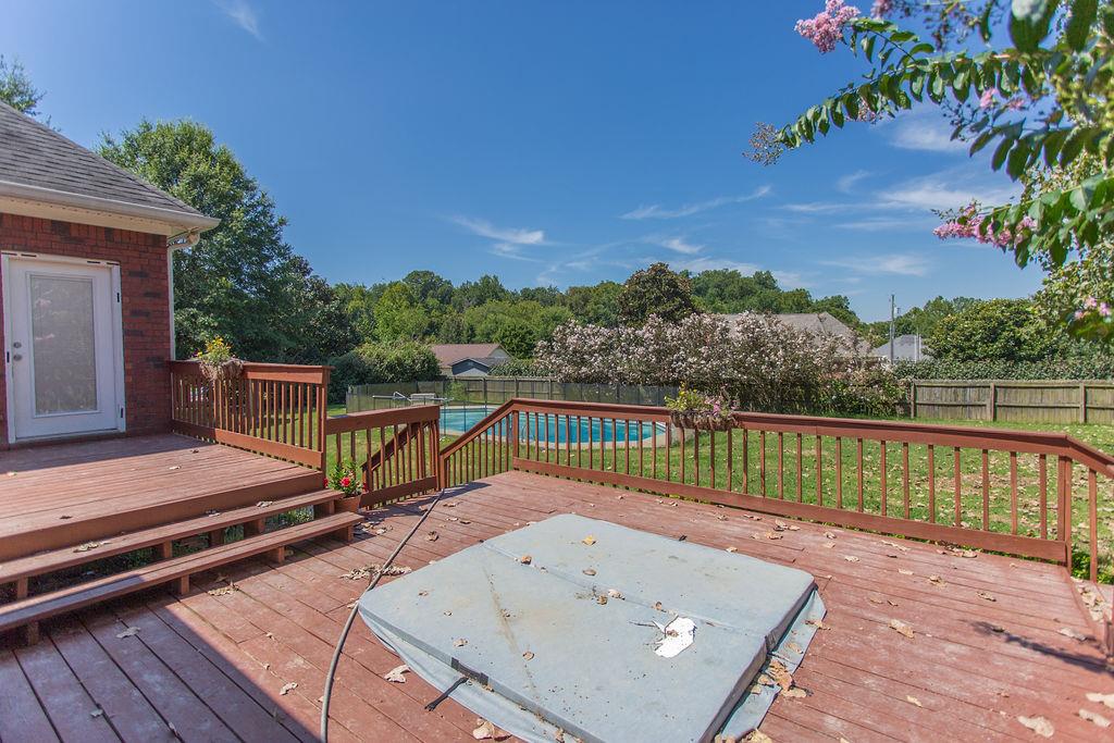 1009 Lake Rise Overlook Gallatin, TN 37066 - Photo 17 of 20 a view of a roof deck with wooden floor and fence