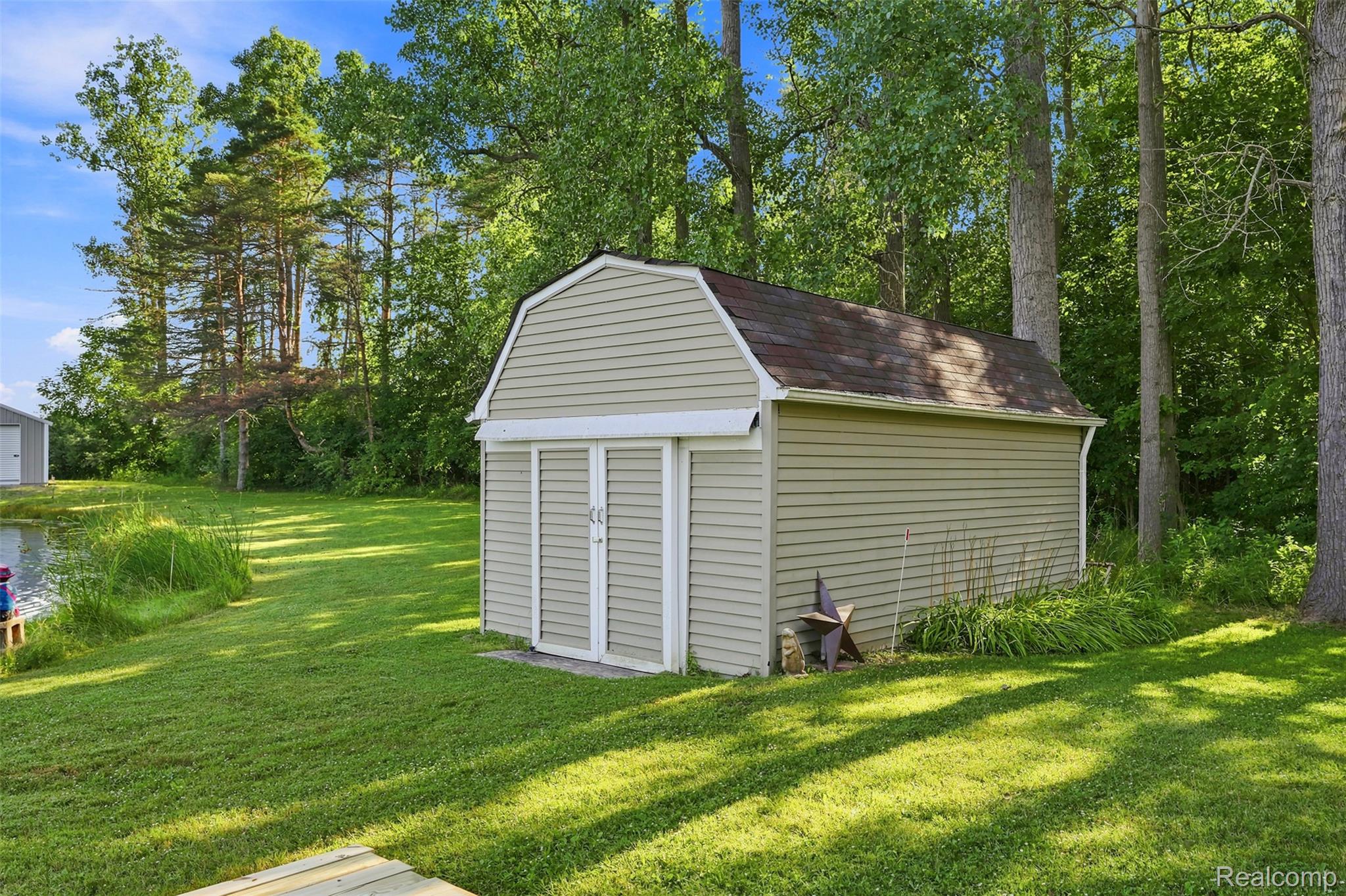 3744 Fish Lake Road Lapeer, MI 48446 - Photo 33 of 50 Gambrel-roof shed with horizontal vinyl siding and double entry doors