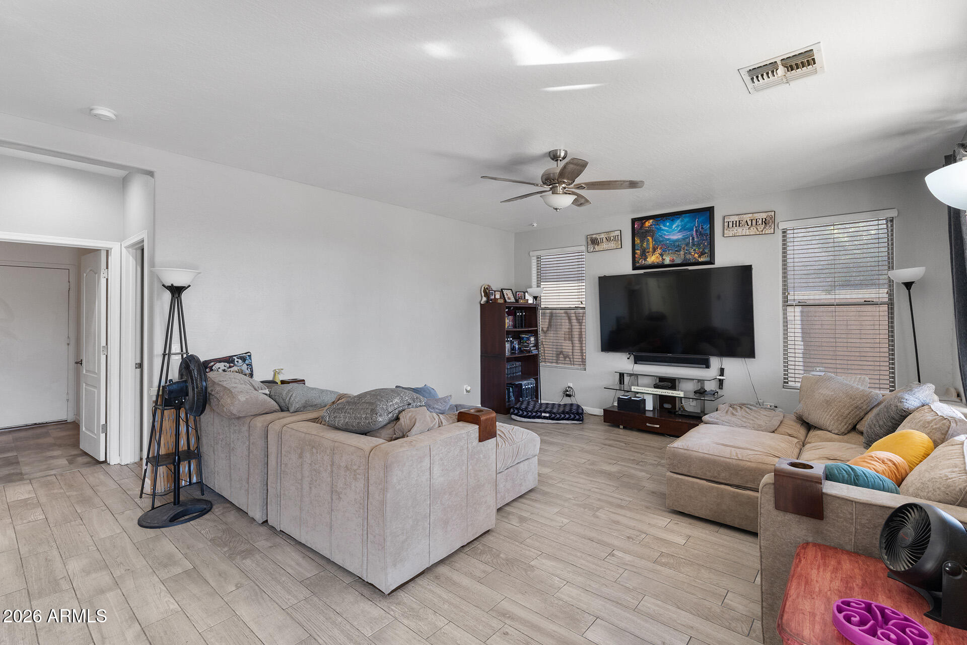 11029 East Decatur Street Mesa, AZ 85207 - Photo 15 of 62 a living room with furniture and a flat screen tv