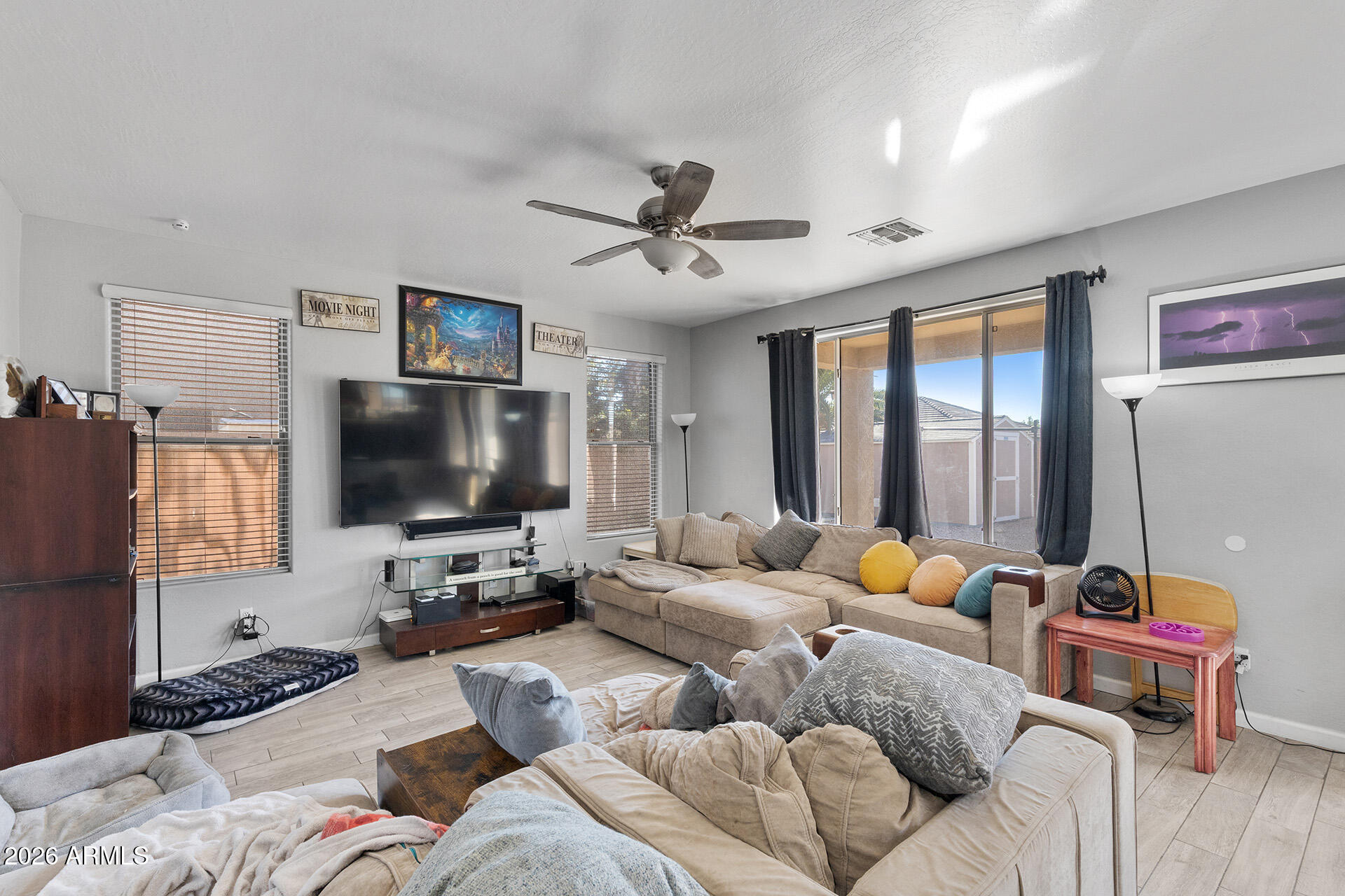 11029 East Decatur Street Mesa, AZ 85207 - Photo 16 of 62 a living room with furniture and a flat screen tv