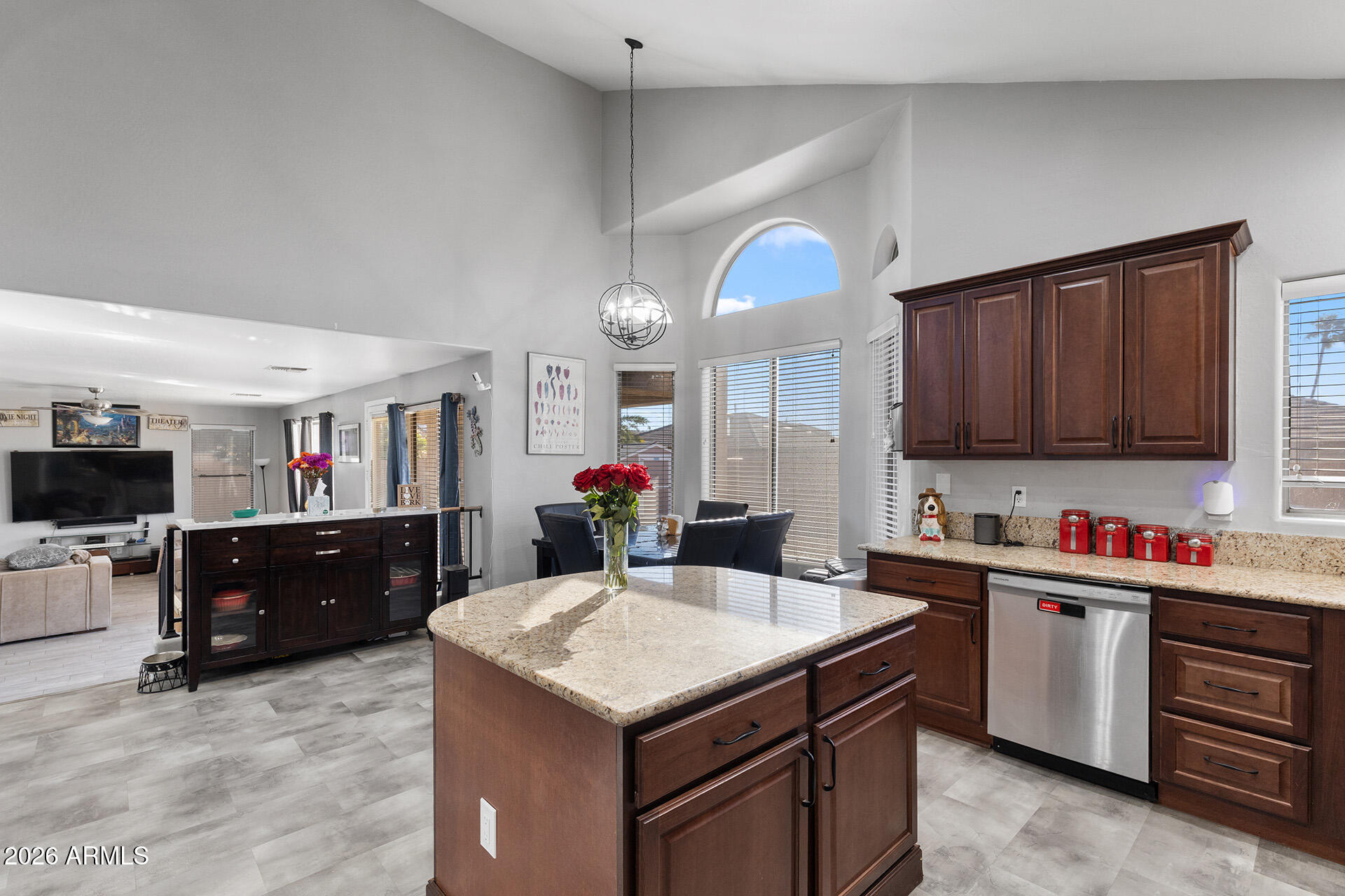 11029 East Decatur Street Mesa, AZ 85207 - Photo 21 of 62 a kitchen with a stove a sink dishwasher and a refrigerator with wooden cabinets