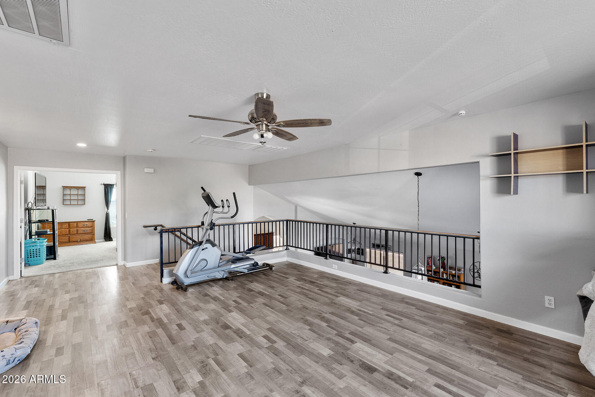 11029 East Decatur Street Mesa, AZ 85207 - Photo 31 of 62 a view of a livingroom with furniture and hardwood floor