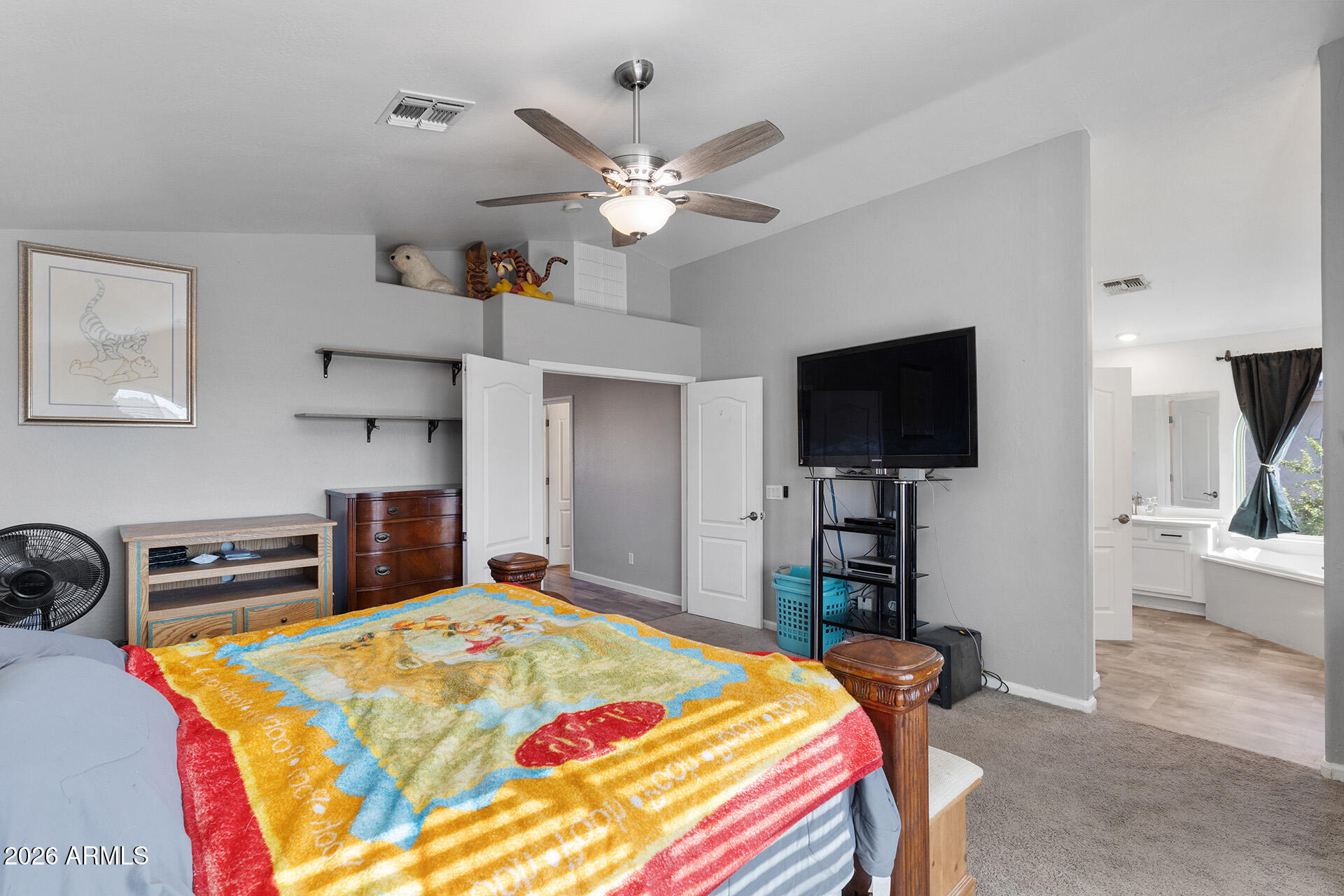11029 East Decatur Street Mesa, AZ 85207 - Photo 36 of 62 a bedroom with a bed and a flat screen tv