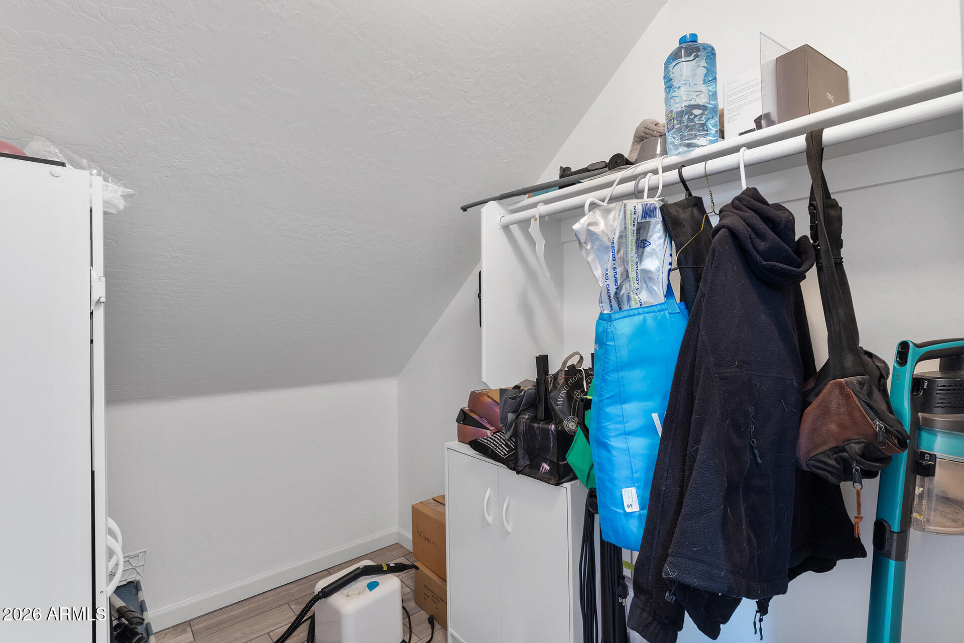 11029 East Decatur Street Mesa, AZ 85207 - Photo 48 of 62 a view of walk in closet with clothes and shoes