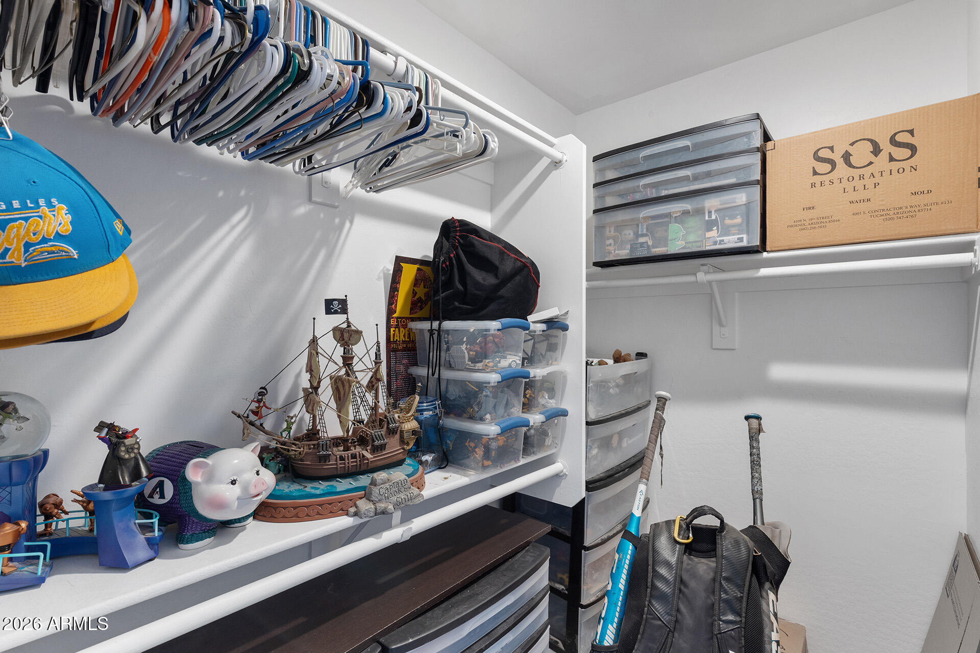 11029 East Decatur Street Mesa, AZ 85207 - Photo 49 of 62 a view of walk in closet with clothes and shoes