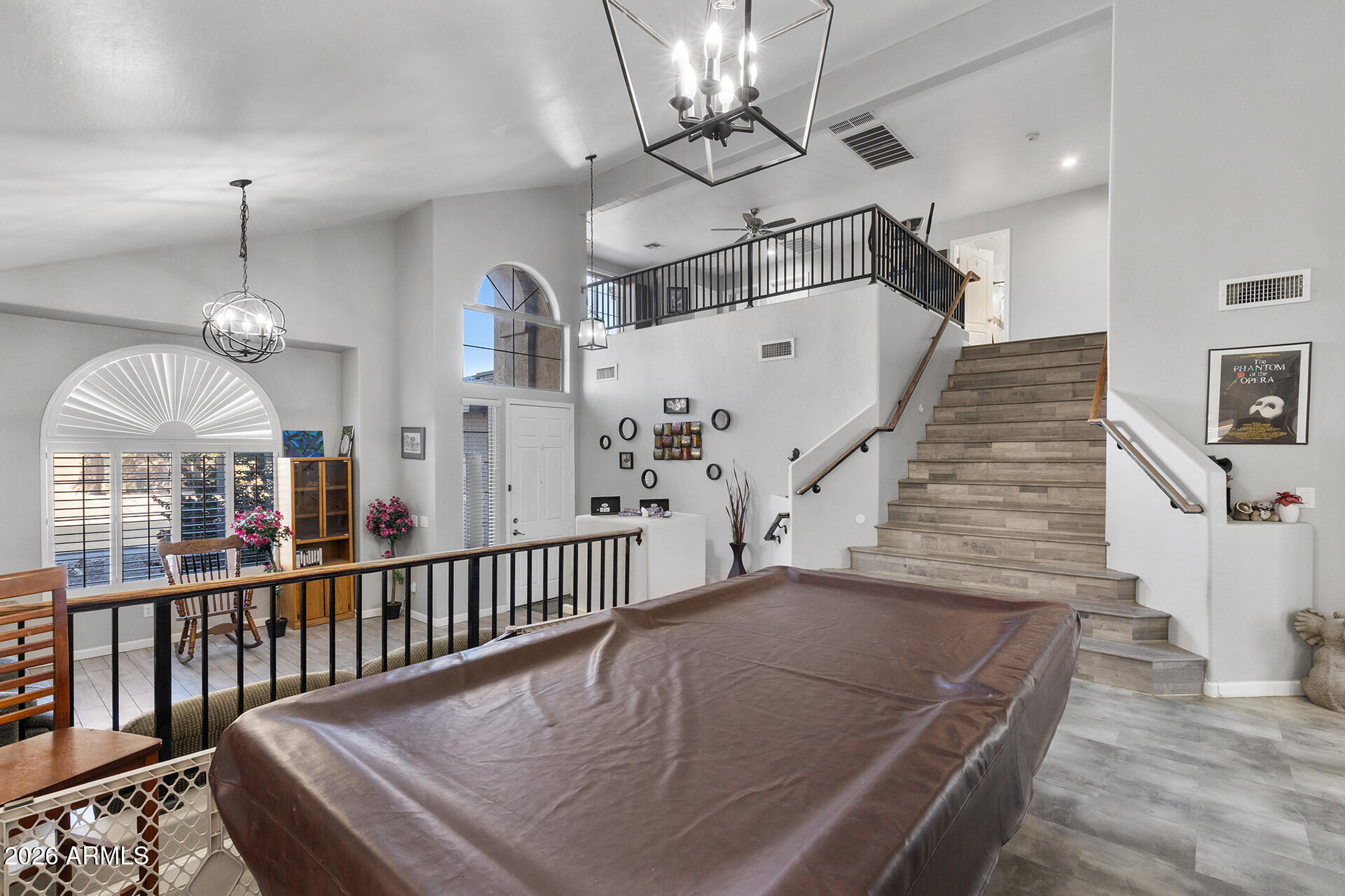 11029 East Decatur Street Mesa, AZ 85207 - Photo 4 of 62 a view of a hallway with dining room and chandelier
