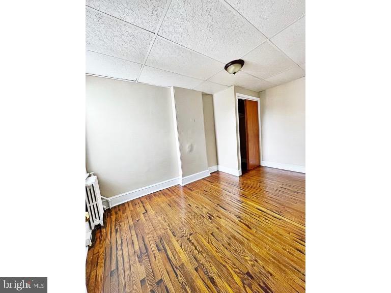 1110 Maple Street Wilmington, DE 19805 - Photo 8 of 10 a view of an empty room with wooden floor