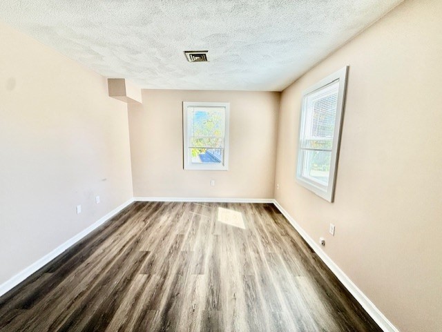 400 Massachusetts Avenue, Unit 4 Arlington, MA 02474 - Photo 14 of 20 an empty room with windows