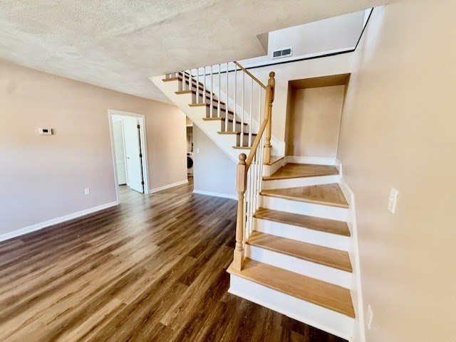 400 Massachusetts Avenue, Unit 4 Arlington, MA 02474 - Photo 15 of 20 a view of entryway and hall with wooden floor