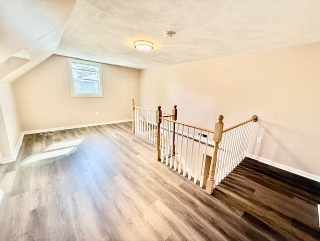 400 Massachusetts Avenue, Unit 4 Arlington, MA 02474 - Photo 19 of 20 a view of wooden floor in an empty room