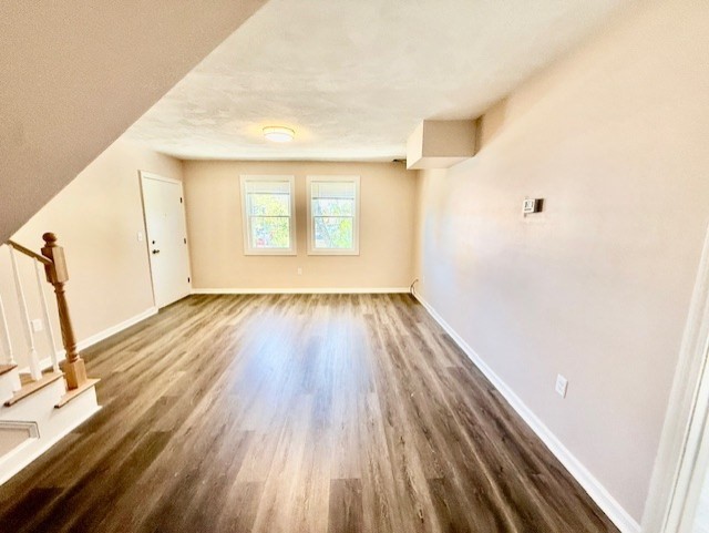 400 Massachusetts Avenue, Unit 4 Arlington, MA 02474 - Photo 7 of 20 a view of a room with wooden floor and a window