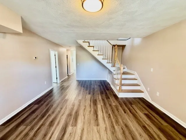a view of entryway with wooden floor