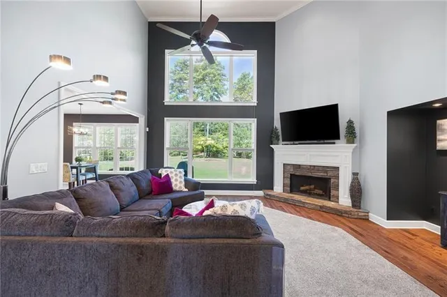 a kitchen with kitchen island stainless steel appliances a refrigerator oven a sink and a stove