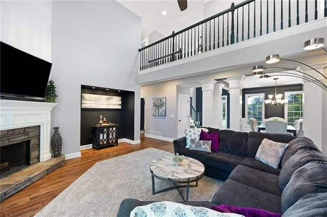 a kitchen with kitchen island granite countertop a table and chairs in it