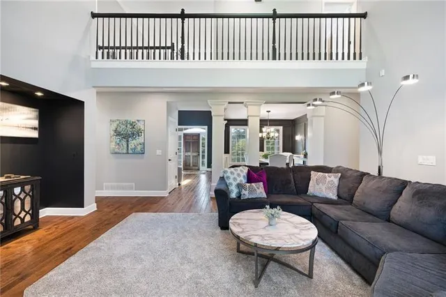 a kitchen with stainless steel appliances granite countertop a stove a sink and a granite counter tops with white cabinets