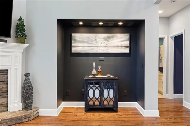 a view of a dining room with furniture wooden floor and chandelier
