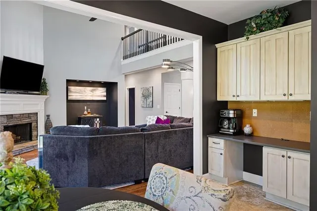 a view of a livingroom with workspace and a window