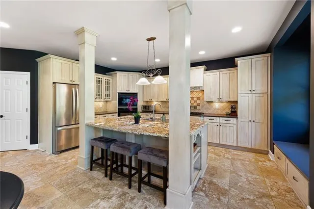 a spacious bathroom with a large tub shower and sink