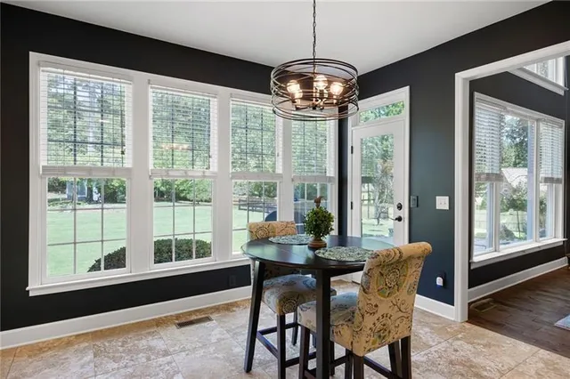 a bathroom with a sink vanity granite shower and a mirror