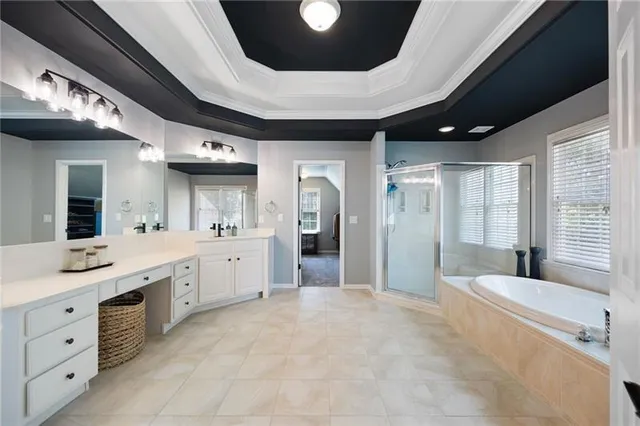 a view of an empty room with window and closet area