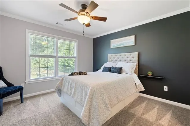an aerial view of a house with swimming pool and garden