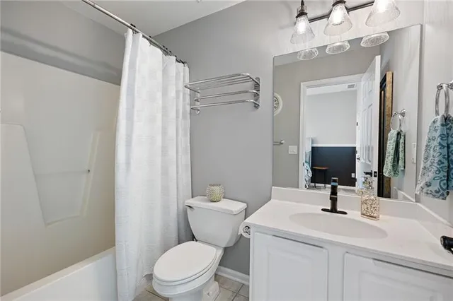 a front view of a house with yard and green space