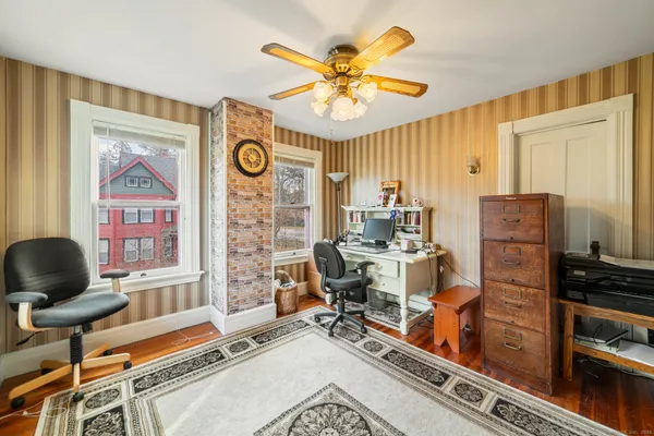 a work room with furniture and a window
