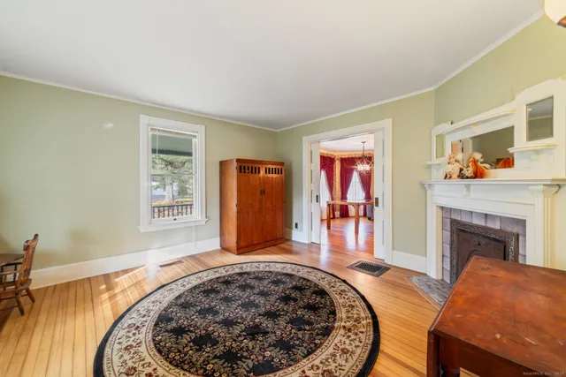 a view of a livingroom with furniture and a fireplace