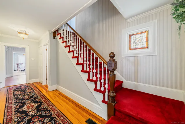 a view of an entryway with wooden floor