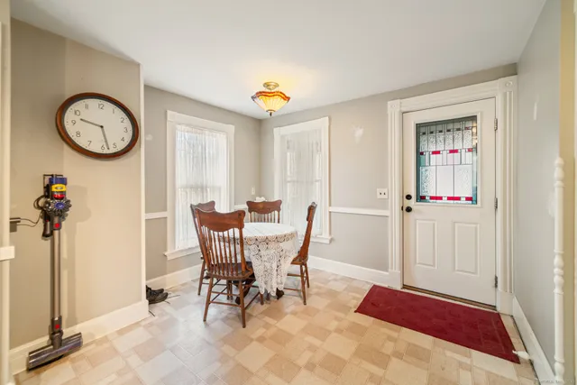 a view of a livingroom with furniture and a window
