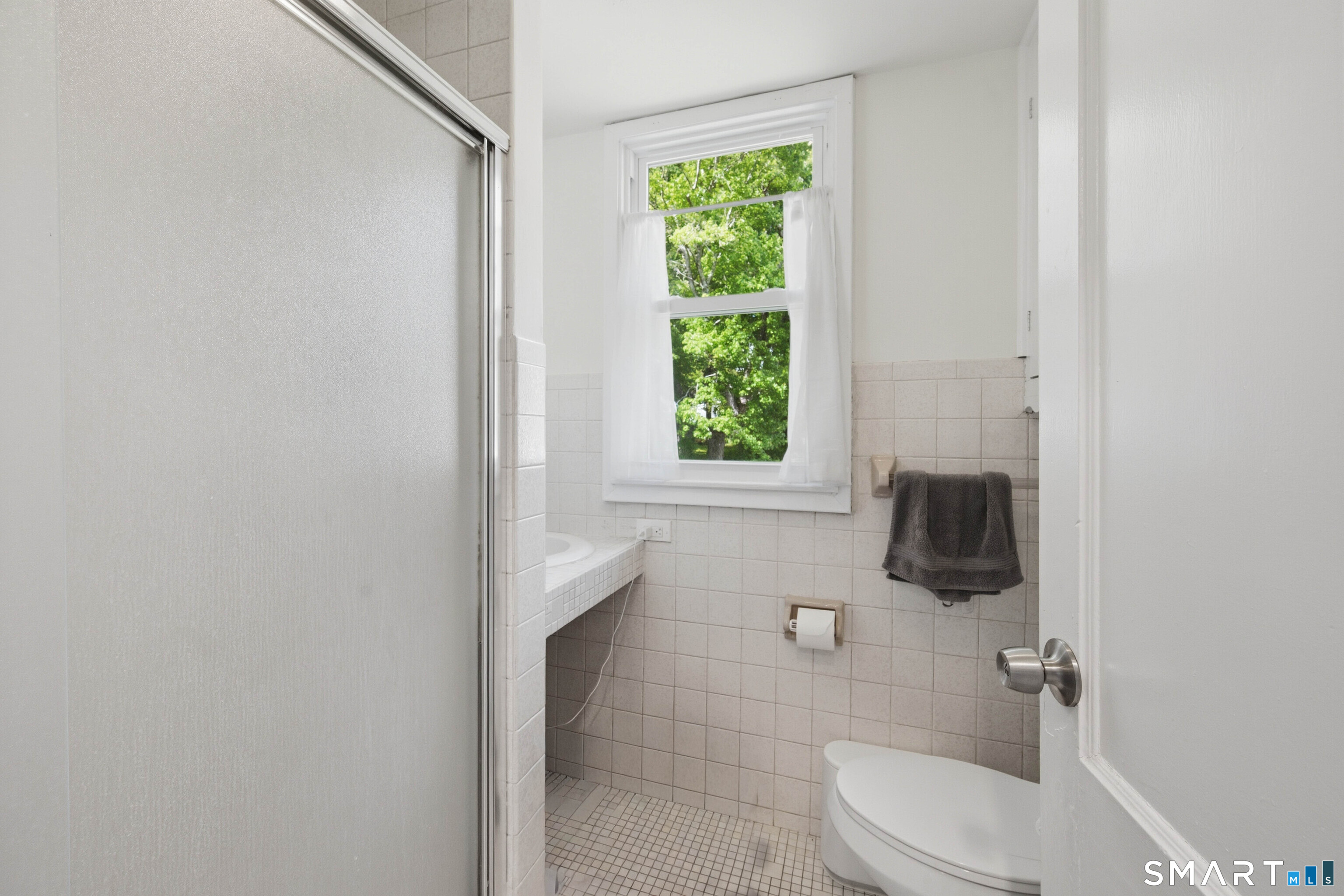 120 May Street Naugatuck, CT 06770 - Photo 24 of 31 a bathroom with a toilet a sink and a window