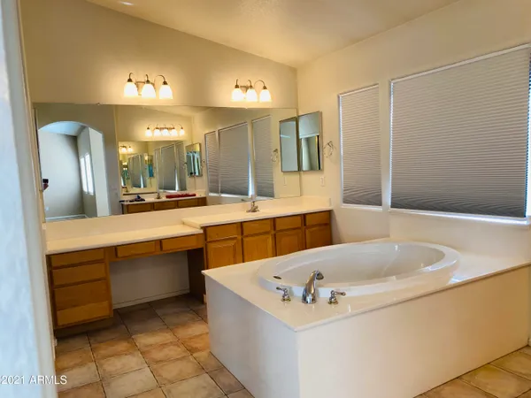 a bathroom with a bathtub and a sink