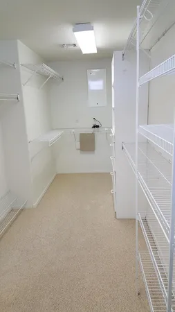 a view of empty room with windows