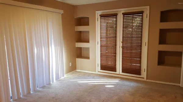 a white toilet sitting next to a bathroom sink