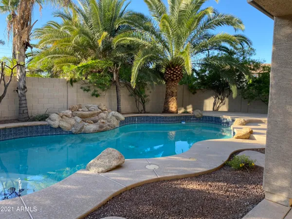 a kitchen with stainless steel appliances a stove a sink and a refrigerator